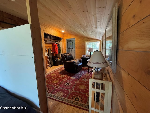 1942 Two Tail Rd, Bonners Ferry, ID 83805 - living area featuring wooden walls, vaulted ceiling, wooden ceiling, and wood finished floors