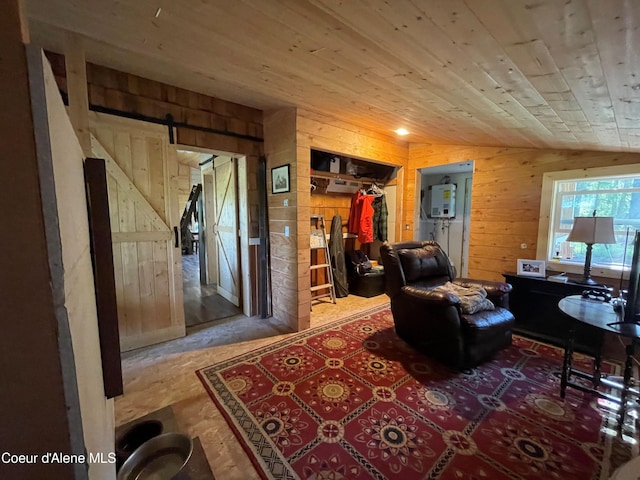 1942 Two Tail Rd, Bonners Ferry, ID 83805 - living room featuring a barn door, wooden walls, and wooden ceiling