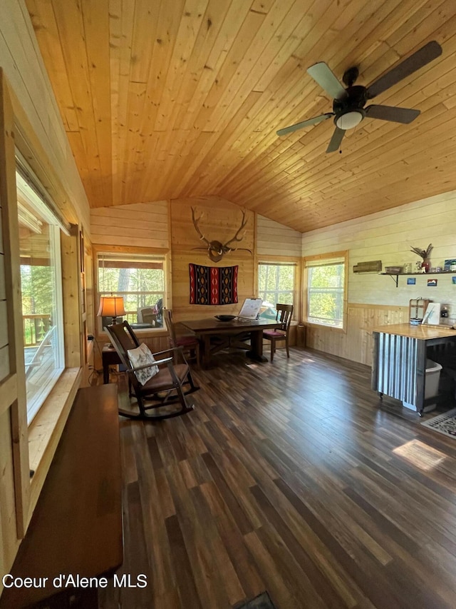1942 Two Tail Rd, Bonners Ferry, ID 83805 - living area featuring vaulted ceiling, wooden walls, wood ceiling, wood finished floors, and plenty of natural light