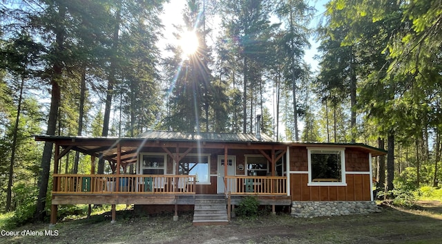 1942 Two Tail Rd, Bonners Ferry, ID 83805 - view of front of property with covered porch, a metal roof, and crawl space