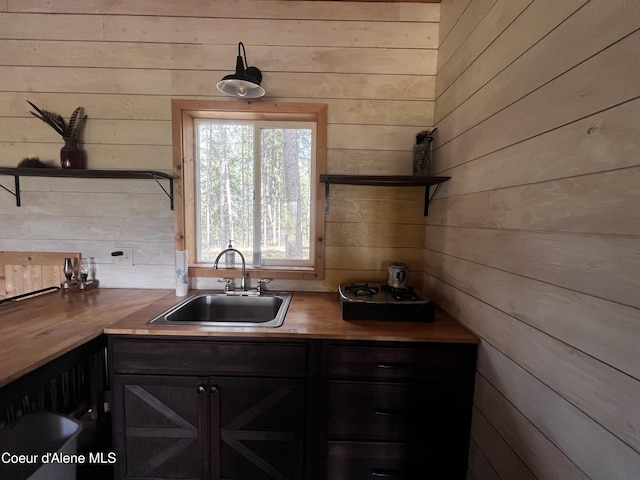 1942 Two Tail Rd, Bonners Ferry, ID 83805 - kitchen with wooden counters, wood walls, and open shelves
