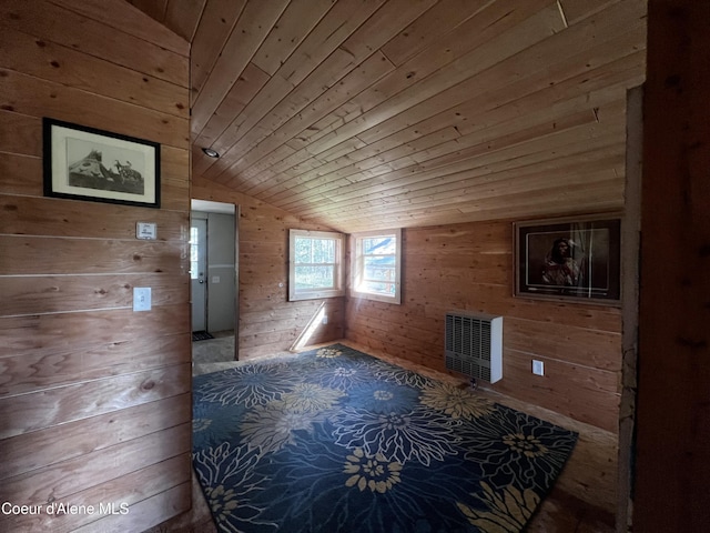 1942 Two Tail Rd, Bonners Ferry, ID 83805 - unfurnished living room featuring wooden walls, vaulted ceiling, wooden ceiling, and heating unit