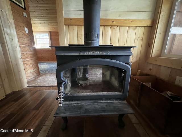 1942 Two Tail Rd, Bonners Ferry, ID 83805 - detailed view of a wood stove, wooden walls, and wood finished floors