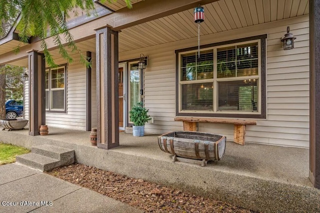 view of exterior entry featuring a porch