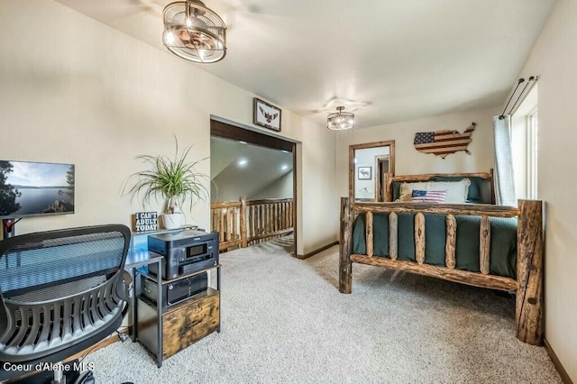 carpeted bedroom featuring baseboards
