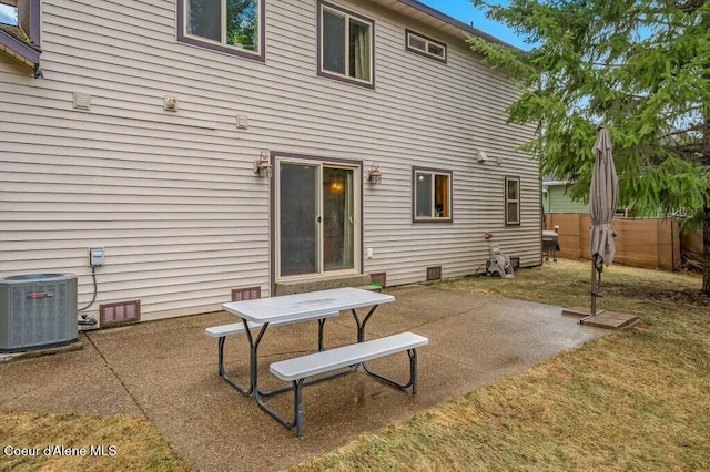 back of property with a patio, central AC, and crawl space