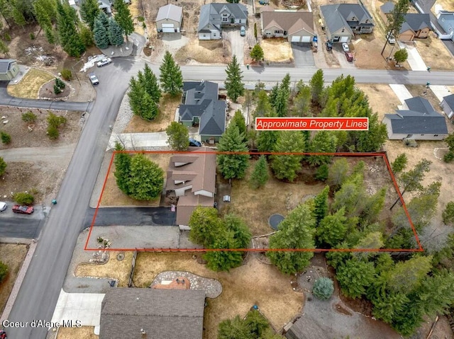 birds eye view of property with a residential view