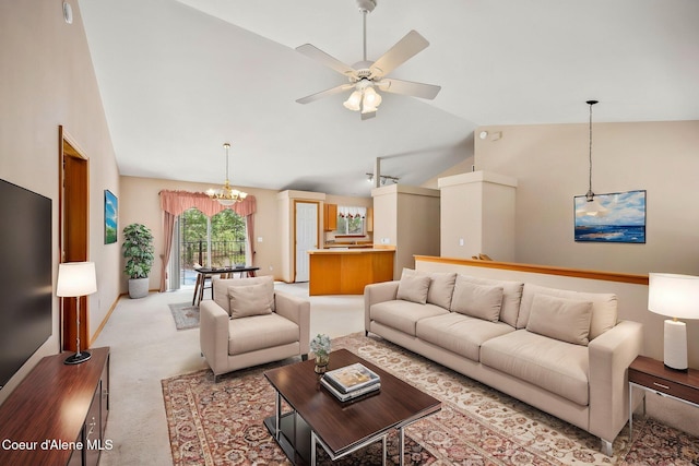 living room featuring lofted ceiling, carpet floors, and ceiling fan with notable chandelier
