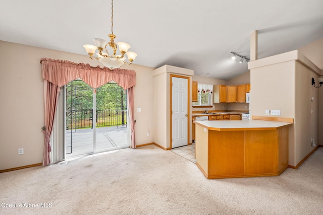kitchen with white microwave, light carpet, a notable chandelier, and baseboards