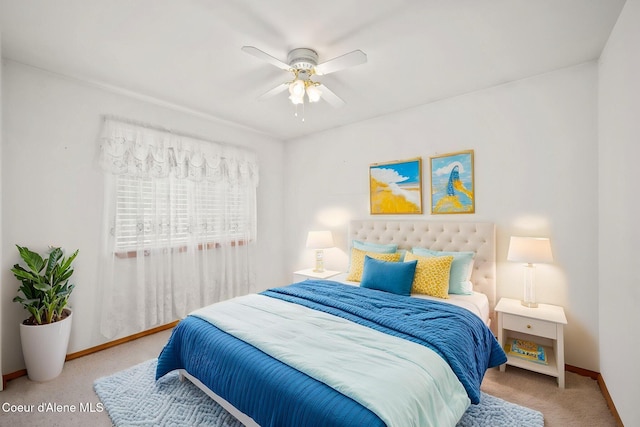 bedroom featuring ceiling fan, carpet flooring, and baseboards
