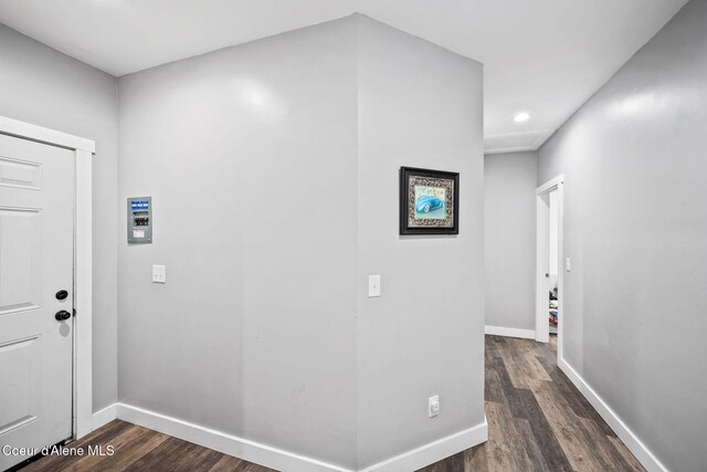 hall with recessed lighting, baseboards, and dark wood finished floors