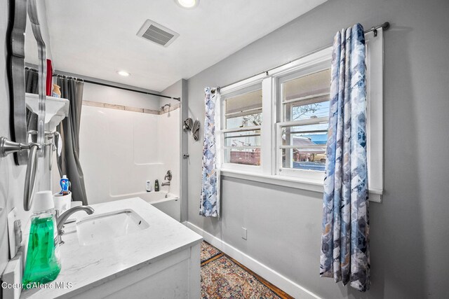bathroom with vanity, baseboards, visible vents, recessed lighting, and shower / bath combo with shower curtain