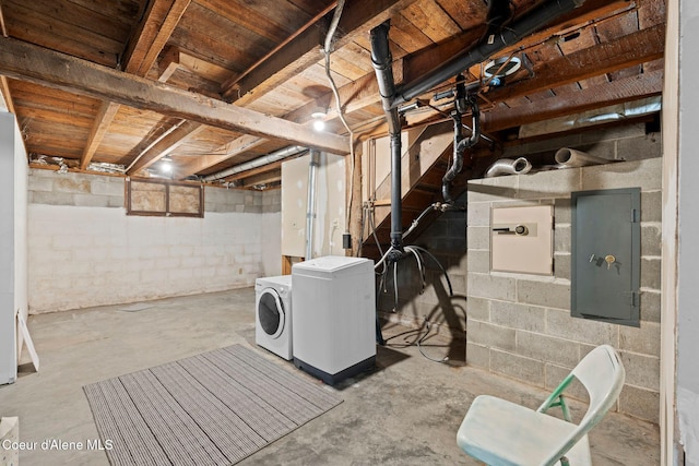 unfinished basement featuring washer and dryer