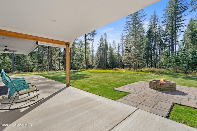 view of patio / terrace featuring a fire pit and a ceiling fan