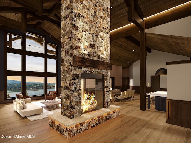 4579 E Plum Rd, Coeur Dalene, ID 83814 - living area featuring wood ceiling, high vaulted ceiling, beam ceiling, wood finished floors, and a water view
