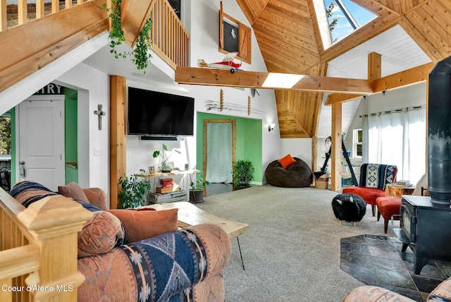 living room featuring carpet flooring, high vaulted ceiling, and a wood stove