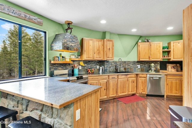 kitchen featuring open shelves, tasteful backsplash, appliances with stainless steel finishes, and a sink