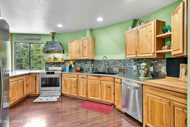 kitchen featuring a sink, open shelves, backsplash, dark wood finished floors, and appliances with stainless steel finishes