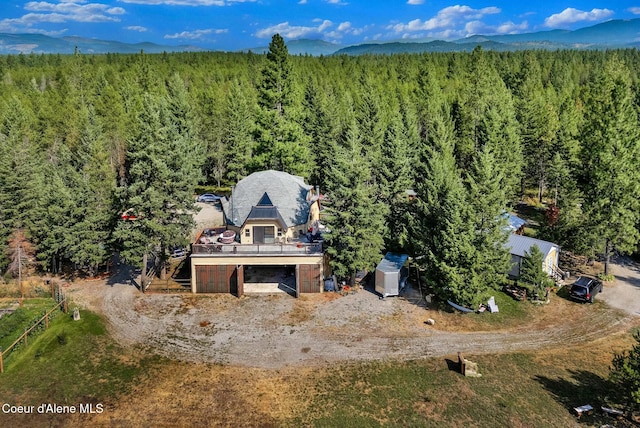 bird's eye view featuring a view of trees and a mountain view