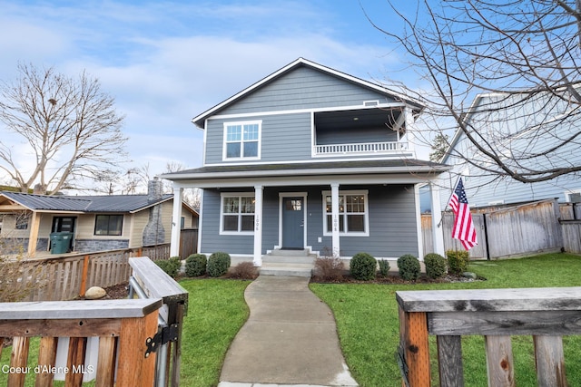 1006 E Garden Ave, Coeur Dalene, ID 83814 - view of front facade featuring fence, a porch, and a front yard