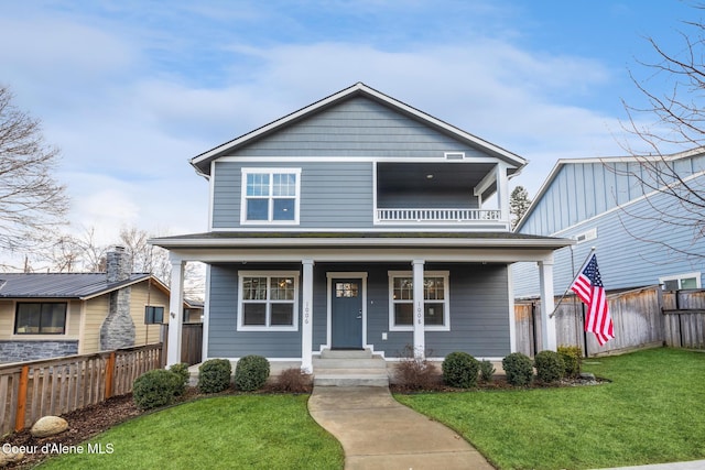 1006 E Garden Ave, Coeur Dalene, ID 83814 - view of front of home featuring fence, covered porch, and a front yard