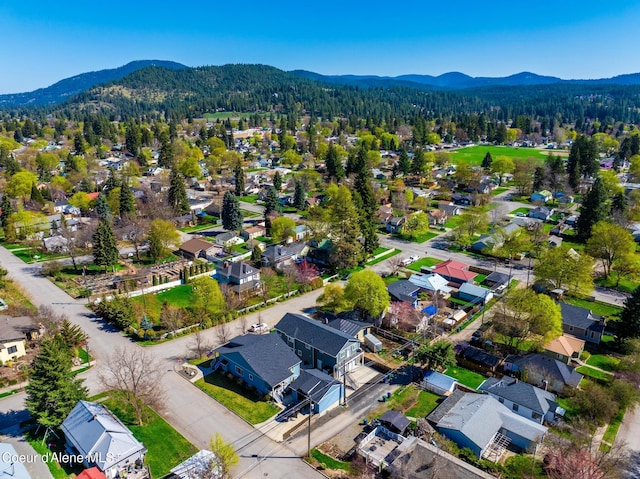 1006 E Garden Ave, Coeur Dalene, ID 83814 - drone / aerial view with a mountain view, a residential view, and a wooded view