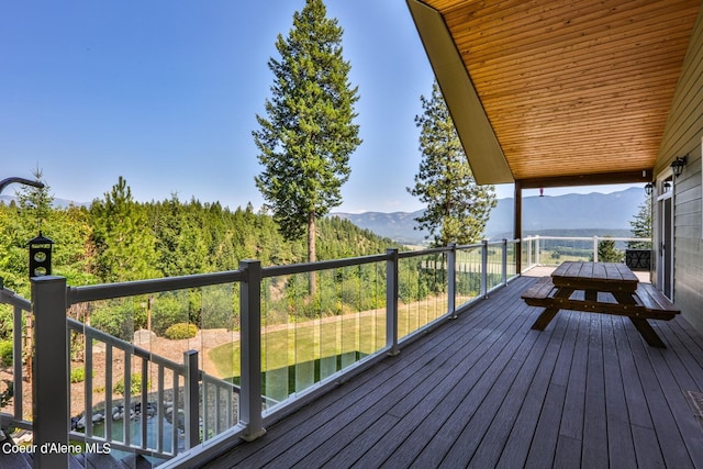 wooden terrace featuring a mountain view