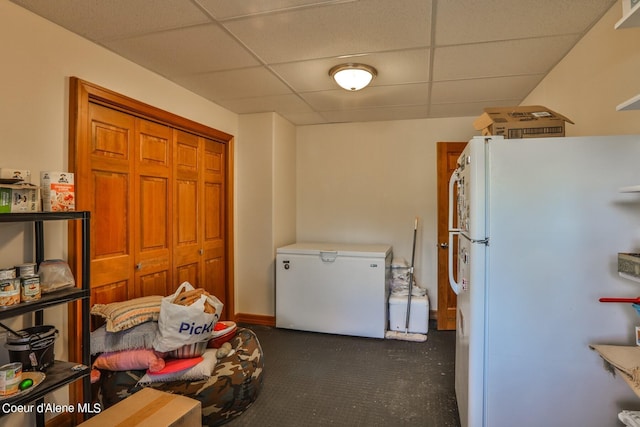 clothes washing area with baseboards
