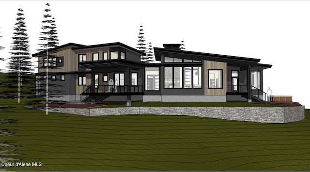 rear view of property featuring a yard