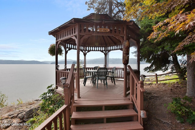 190 W Eagle Crest Dr, Coeur Dalene, ID 83814 - deck featuring outdoor dining space, a gazebo, and a water and mountain view