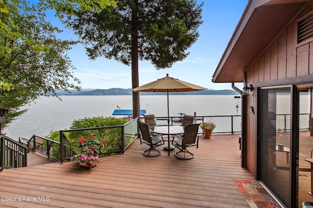 190 W Eagle Crest Dr, Coeur Dalene, ID 83814 - wooden deck featuring outdoor dining area and a water view