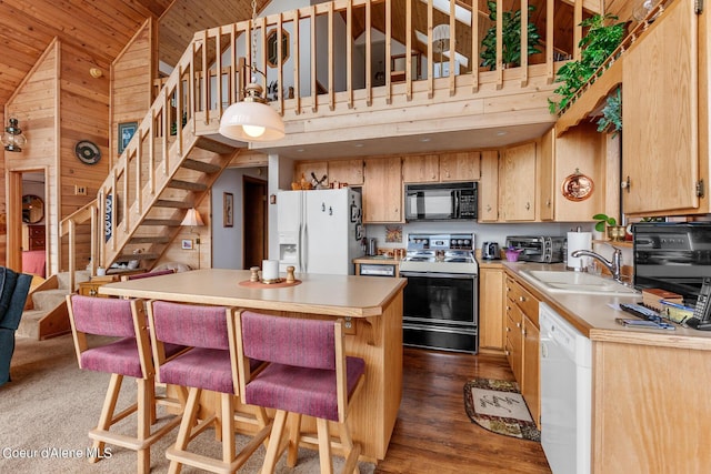 190 W Eagle Crest Dr, Coeur Dalene, ID 83814 - kitchen featuring a sink, white appliances, dark wood-style floors, and light countertops