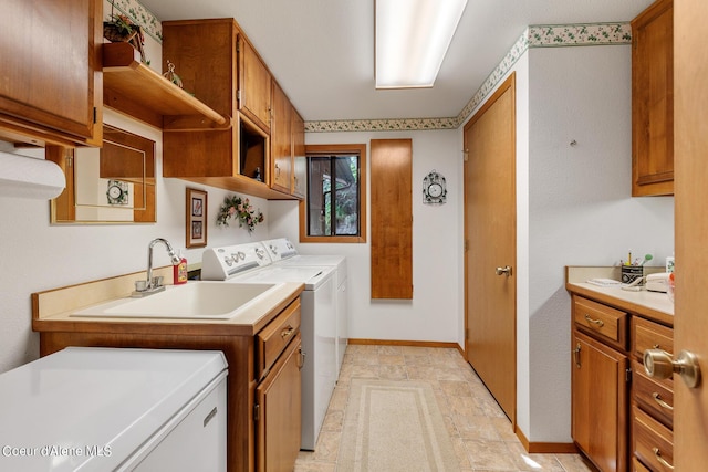 190 W Eagle Crest Dr, Coeur Dalene, ID 83814 - laundry area with washer and dryer, cabinet space, baseboards, and a sink