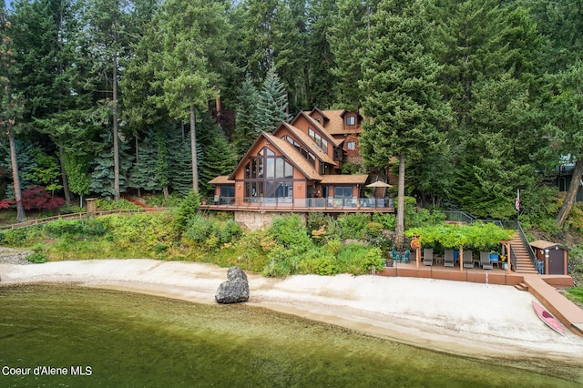 190 W Eagle Crest Dr, Coeur Dalene, ID 83814 - back of house featuring stairway and a wooded view