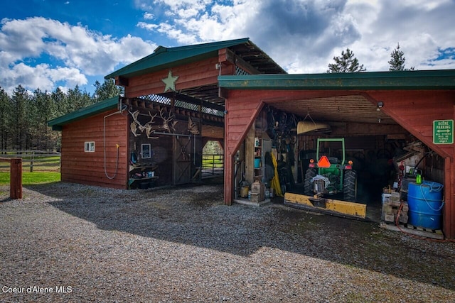 415 Shale Rd, Priest River, ID 83856 - view of home's exterior featuring an outdoor structure, an exterior structure, and driveway