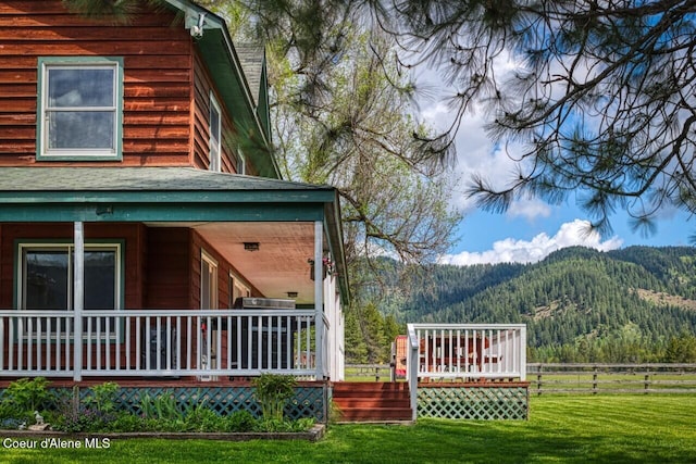 415 Shale Rd, Priest River, ID 83856 - view of side of property featuring a mountain view and covered porch