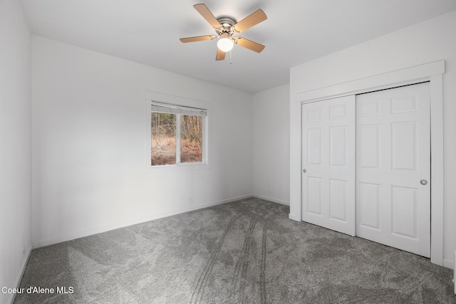 unfurnished bedroom featuring carpet floors, baseboards, a closet, and ceiling fan