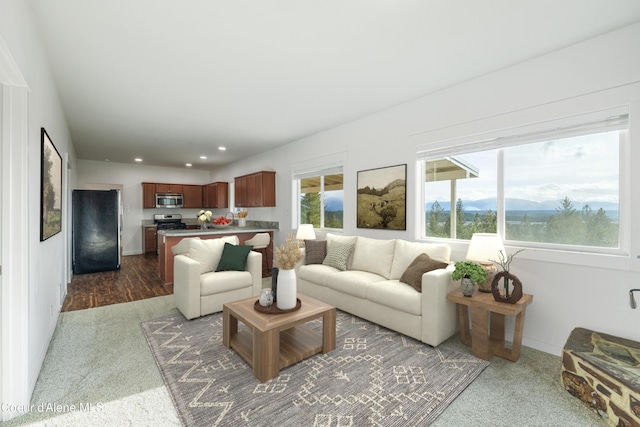 living room with a mountain view and recessed lighting