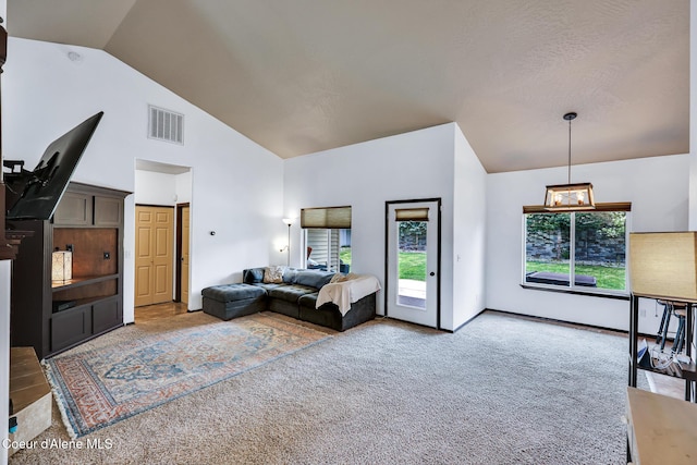 7068 N Epervier Ln, Coeur Dalene, ID 83815 - living room featuring carpet flooring and high vaulted ceiling
