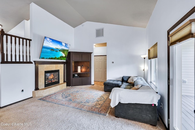 7068 N Epervier Ln, Coeur Dalene, ID 83815 - carpeted living room featuring a fireplace and high vaulted ceiling