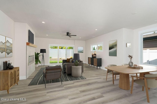 7365 N Breaux, Coeur Dalene, ID 83815 - living area featuring light wood-type flooring, a fireplace, a ceiling fan, baseboards, and recessed lighting