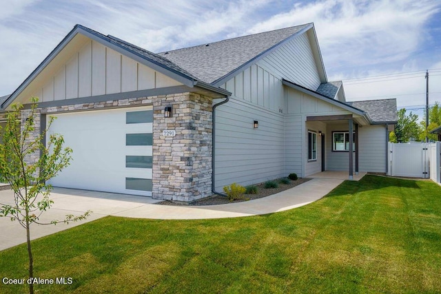 7365 N Breaux, Coeur Dalene, ID 83815 - view of front of home with board and batten siding, a shingled roof, a gate, an attached garage, and concrete driveway