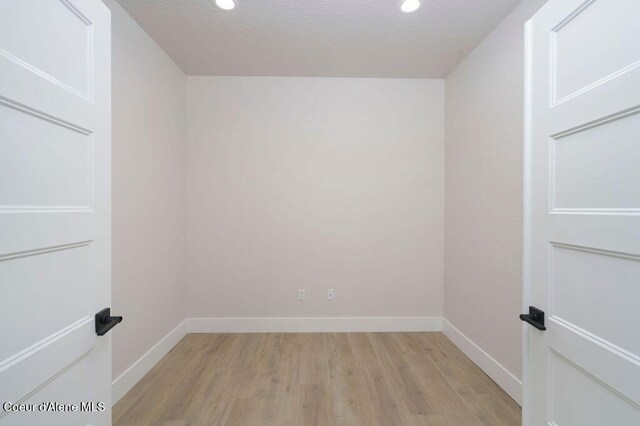 7279 N Grafton St, Coeur Dalene, ID 83815 - unfurnished room featuring baseboards, light wood-type flooring, and recessed lighting