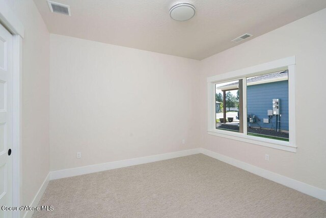 7279 N Grafton St, Coeur Dalene, ID 83815 - spare room featuring carpet floors and baseboards
