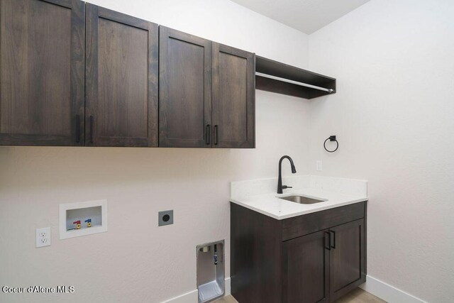 7279 N Grafton St, Coeur Dalene, ID 83815 - washroom featuring hookup for an electric dryer, washer hookup, cabinet space, and baseboards