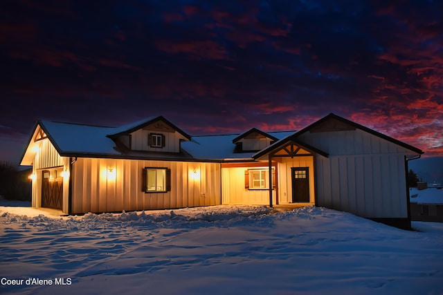 rustic home featuring board and batten siding and a garage