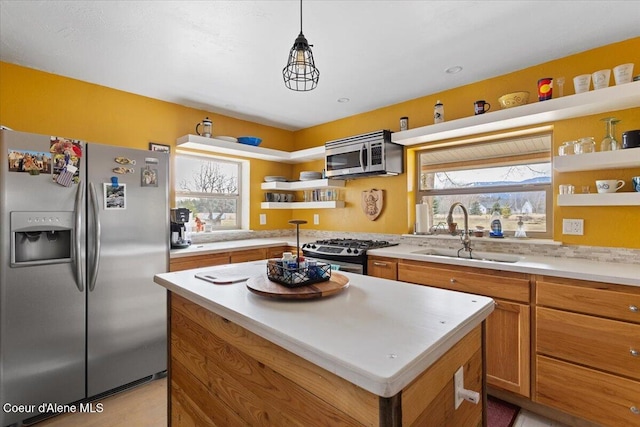 kitchen featuring a sink, stainless steel appliances, brown cabinetry, and open shelves