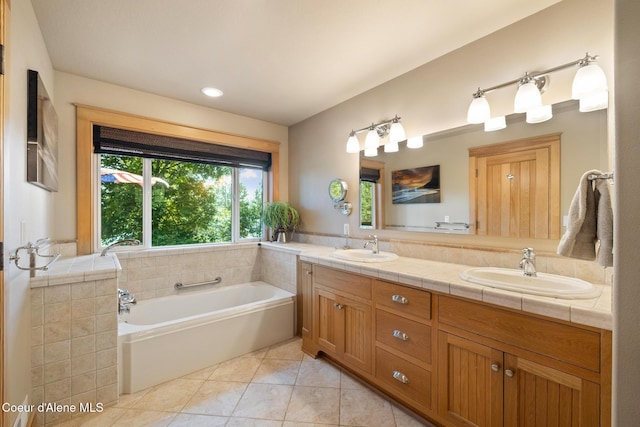4459 E Ogara Rd, Harrison, ID 83833 - bathroom with tile patterned flooring, a sink, double vanity, and a bath