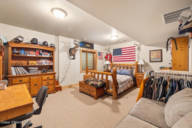 4459 E Ogara Rd, Harrison, ID 83833 - bedroom with baseboards, visible vents, and carpet