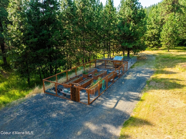 4459 E Ogara Rd, Harrison, ID 83833 - surrounding community featuring a garden, fence, and an outdoor structure